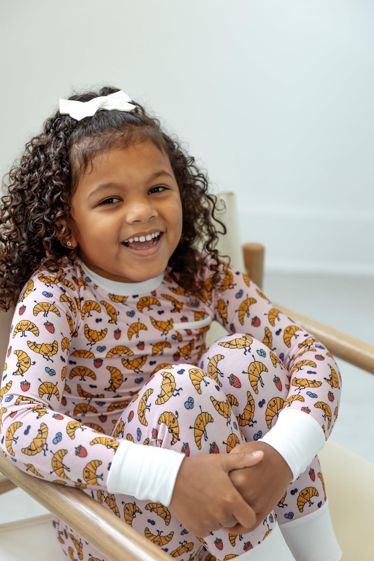 portrait of girl in croissant pajamas