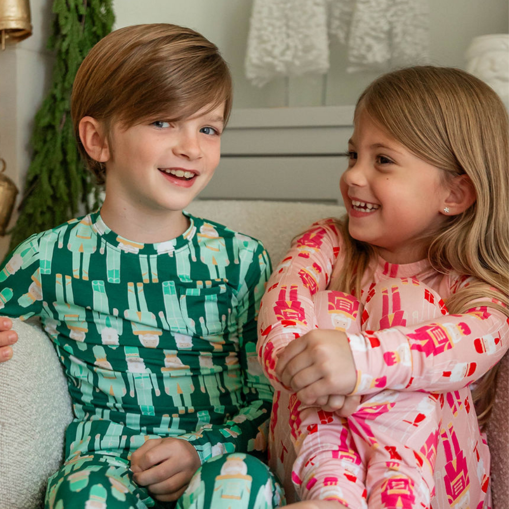 Family in matching PB & Grape holiday pajamas
